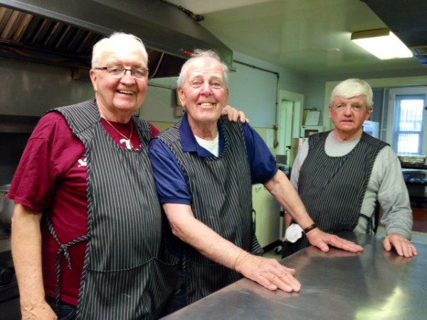 From left to right: St. John's Parish Manager Vincent Smith, Tuesday Crew volunteer Buddy McNulty, and John McGlinchy